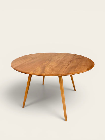 Rare Vintage MCM Ercol Blonde Drop Leaf Round Dining Table by Lucian Ercolani in England