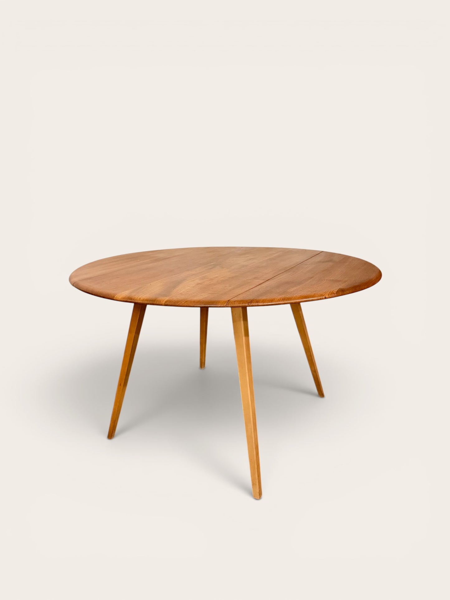 Rare Vintage MCM Ercol Blonde Drop Leaf Round Dining Table by Lucian Ercolani in England