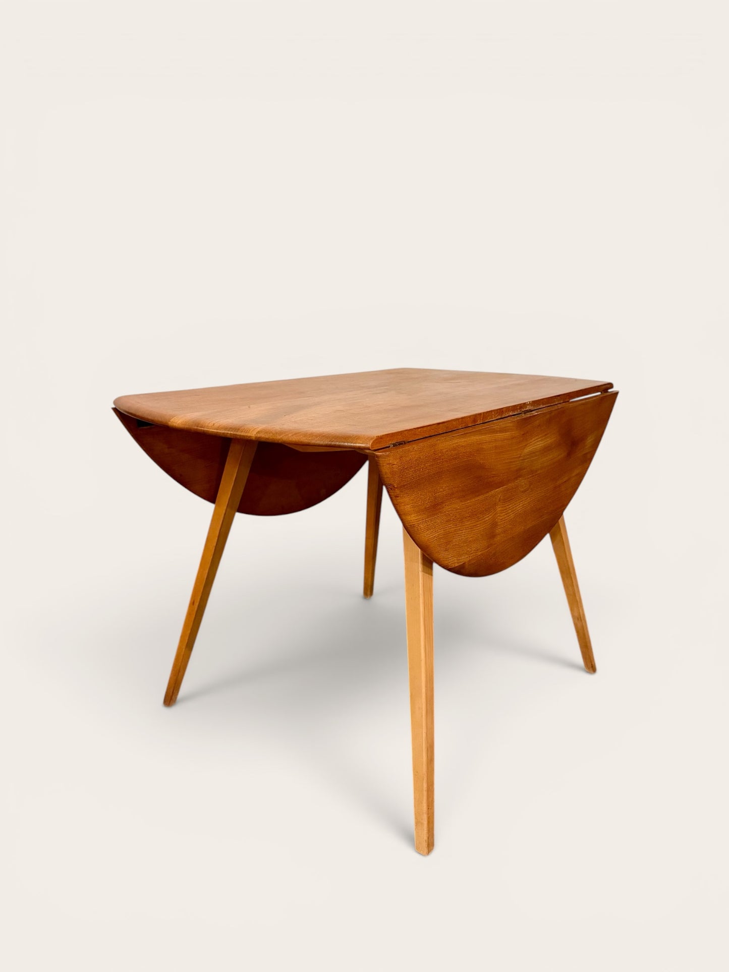 Rare Vintage MCM Ercol Blonde Drop Leaf Round Dining Table by Lucian Ercolani in England