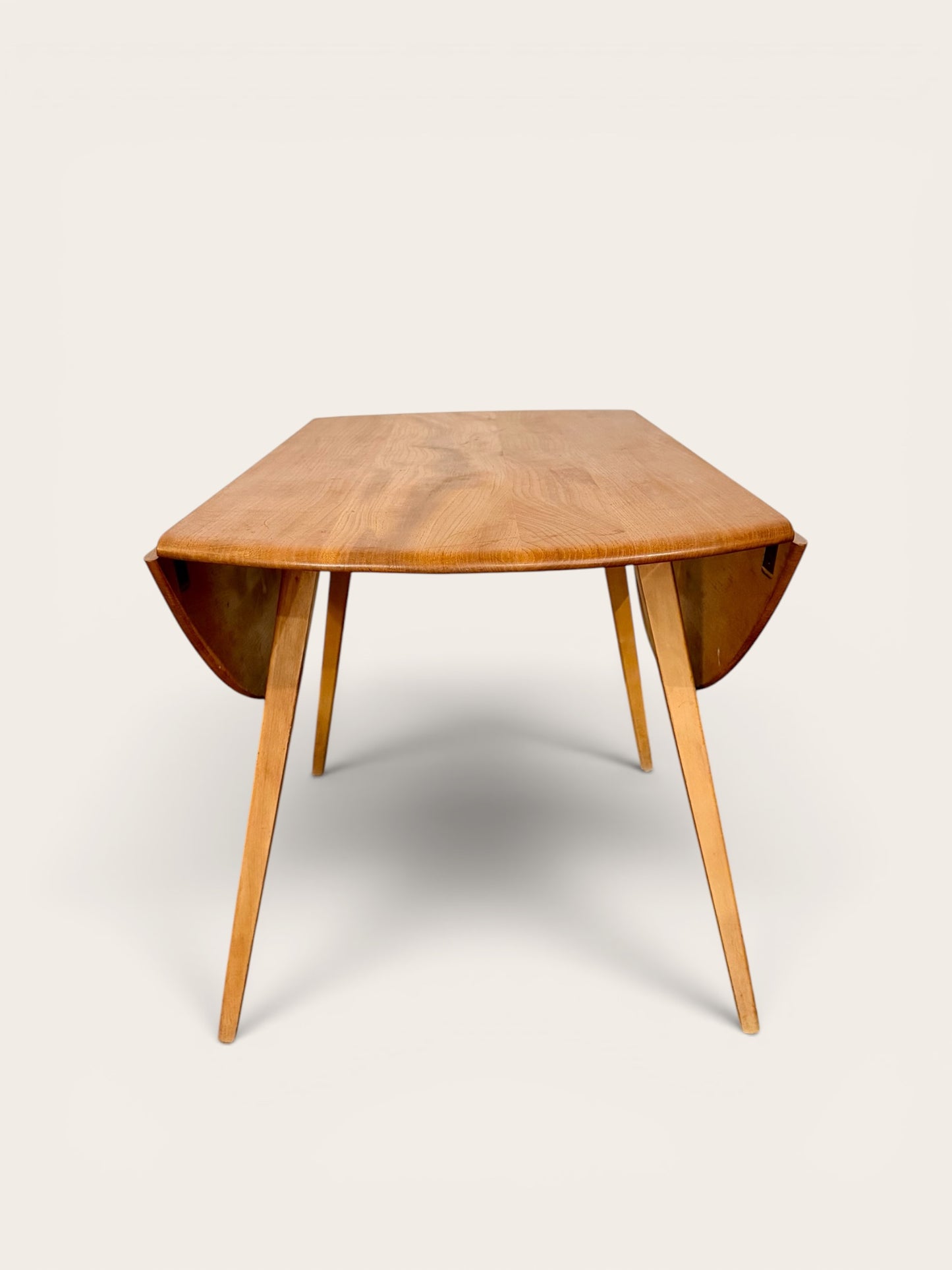 Rare Vintage MCM Ercol Blonde Drop Leaf Round Dining Table by Lucian Ercolani in England