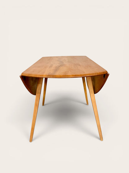 Rare Vintage MCM Ercol Blonde Drop Leaf Round Dining Table by Lucian Ercolani in England